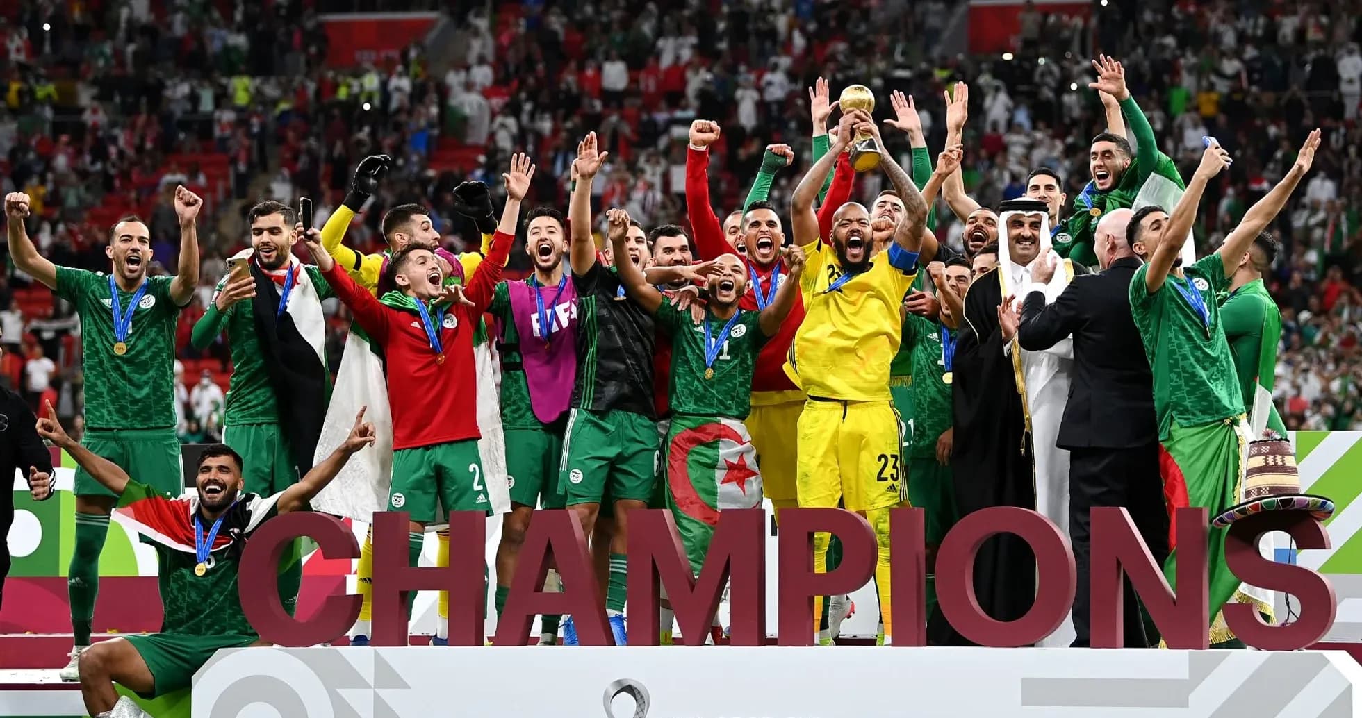 Algeria team celebrating victory with trophy
