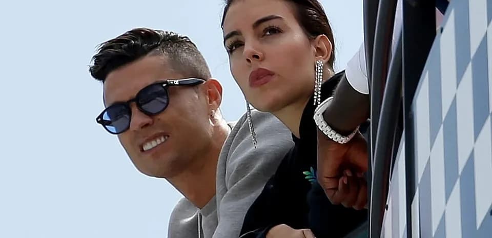 Couple watching from balcony during event
