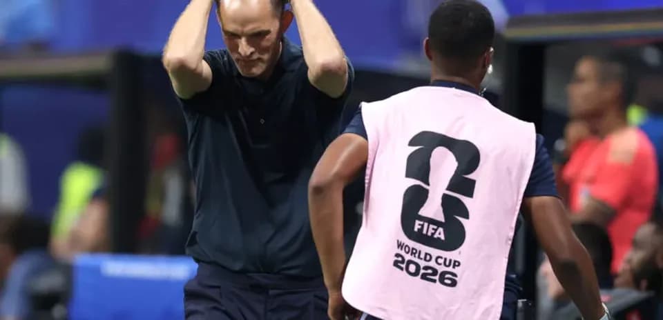Coach with hands on head during match situation