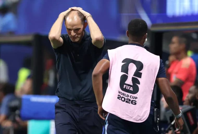 Coach with hands on head during match situation