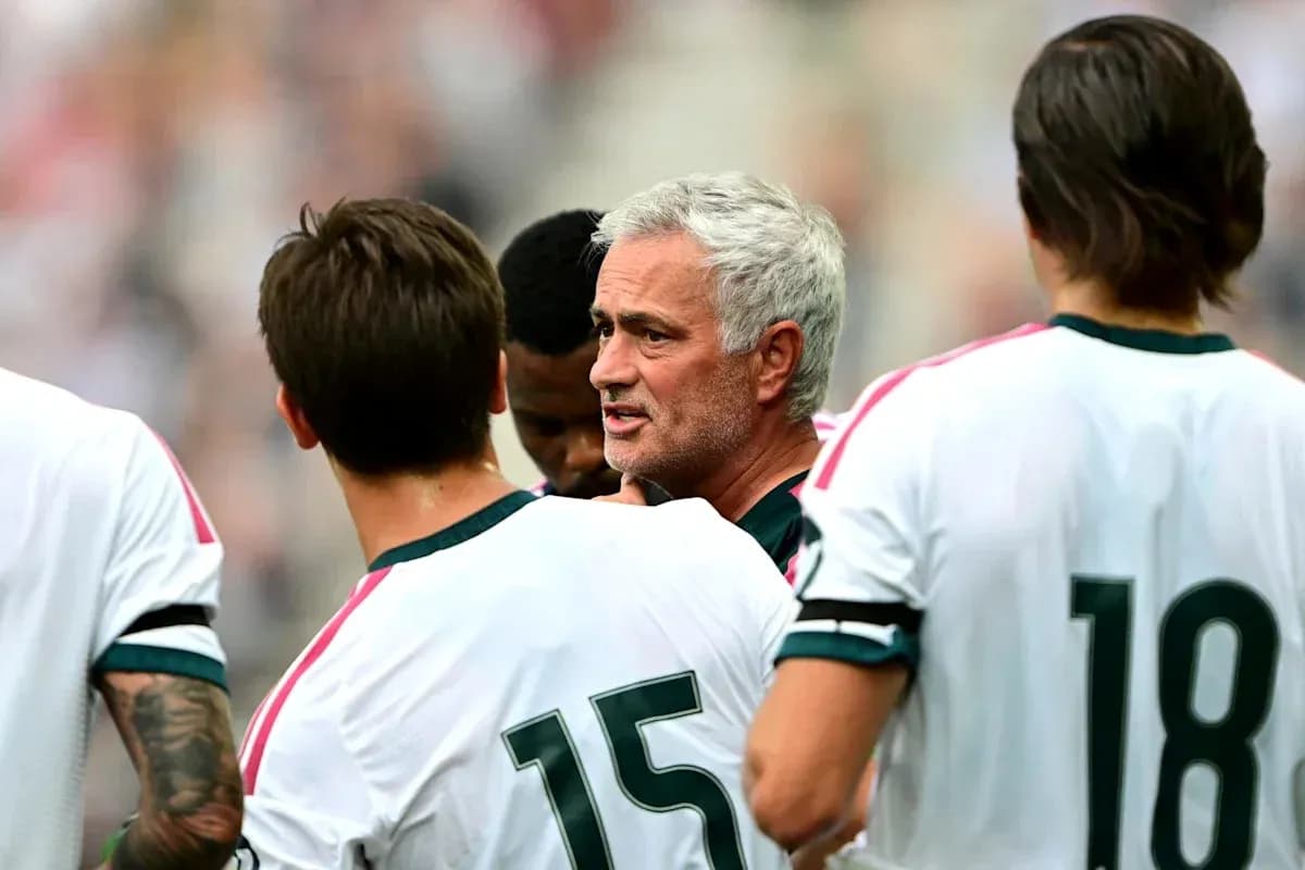 Mourinho discussing strategy with players during match
