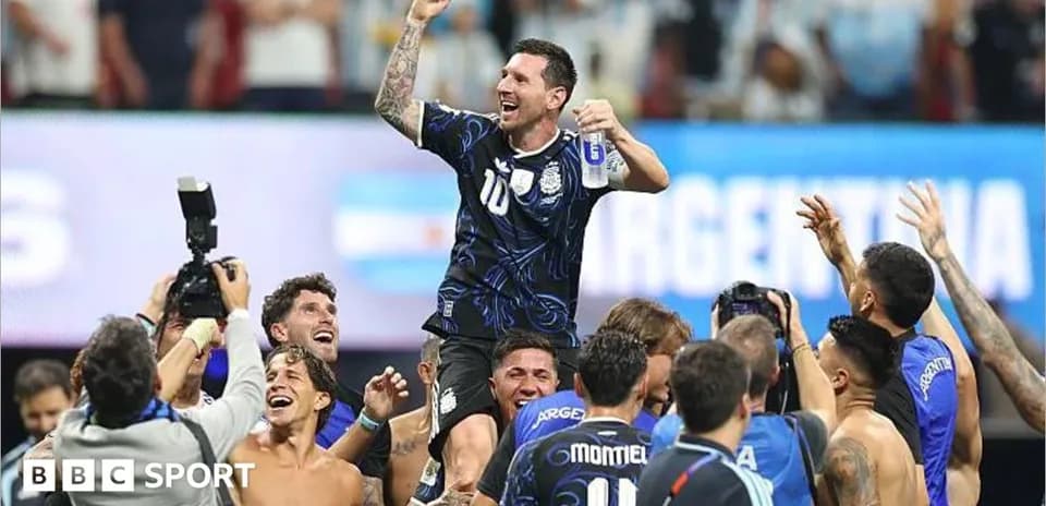 Lionel Messi celebrated by teammates after victory