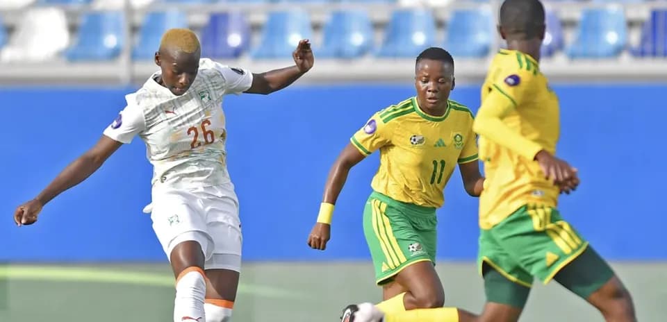 Ivorian player kicking the ball during match