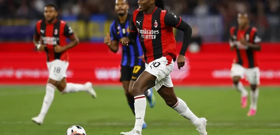 Milan player dribbling the ball during match