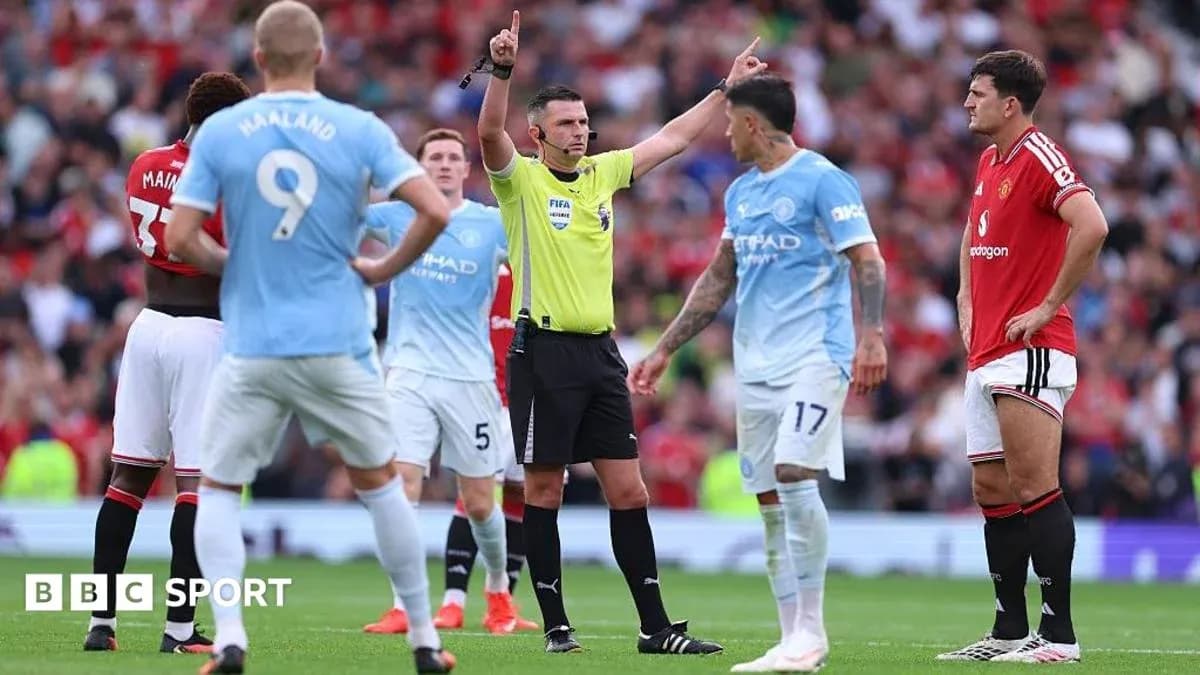 Referee signaling a decision during match between teams