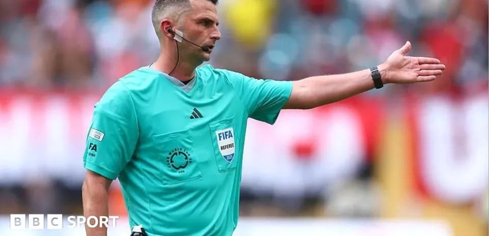 Referee giving instructions during a football match