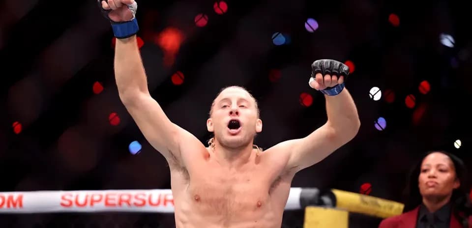 MMA fighter celebrating victory in the octagon