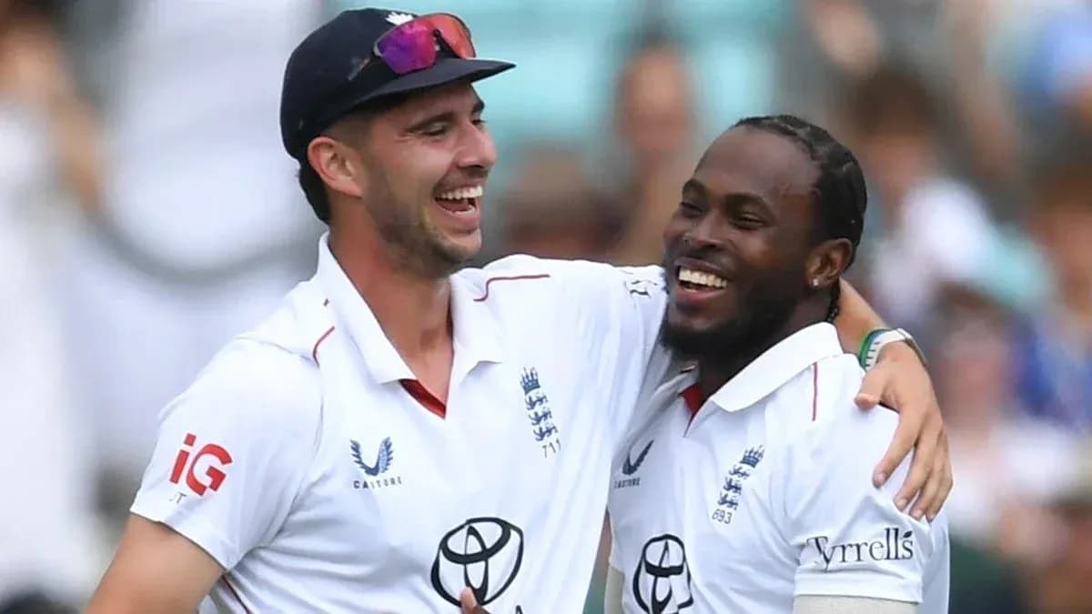 Two cricket players celebrating a wicket together