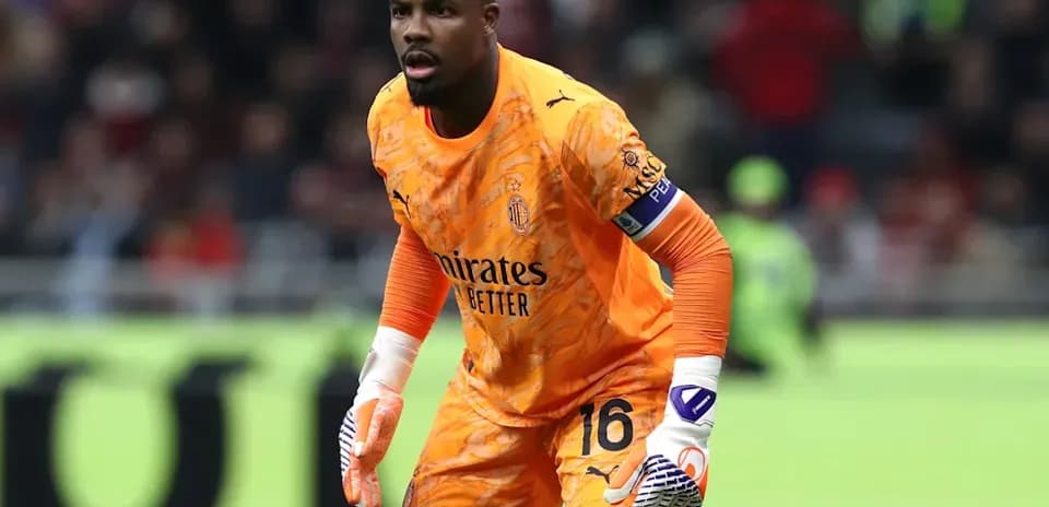 Goalkeeper in orange uniform preparing for play