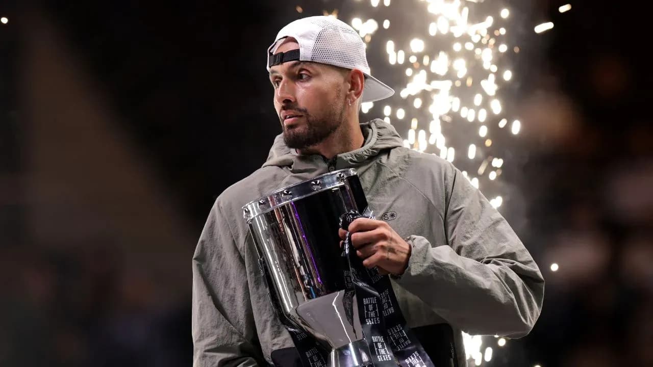 Athlete holding trophy with sparks in background
