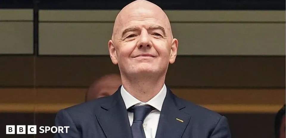 Man in suit smiling at event