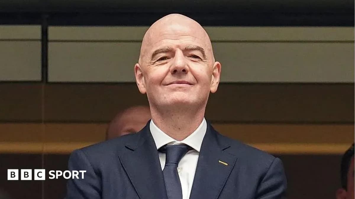 Man in suit smiling at event