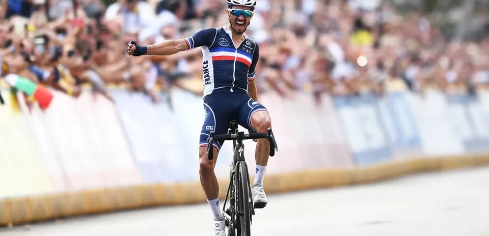 Cyclist celebrating victory at a race finish line