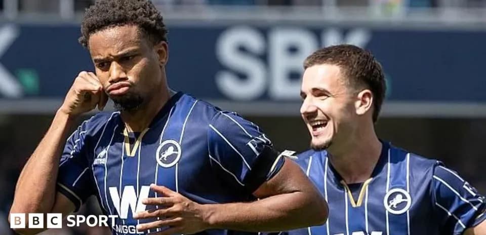 Millwall players celebrating a goal on the pitch
