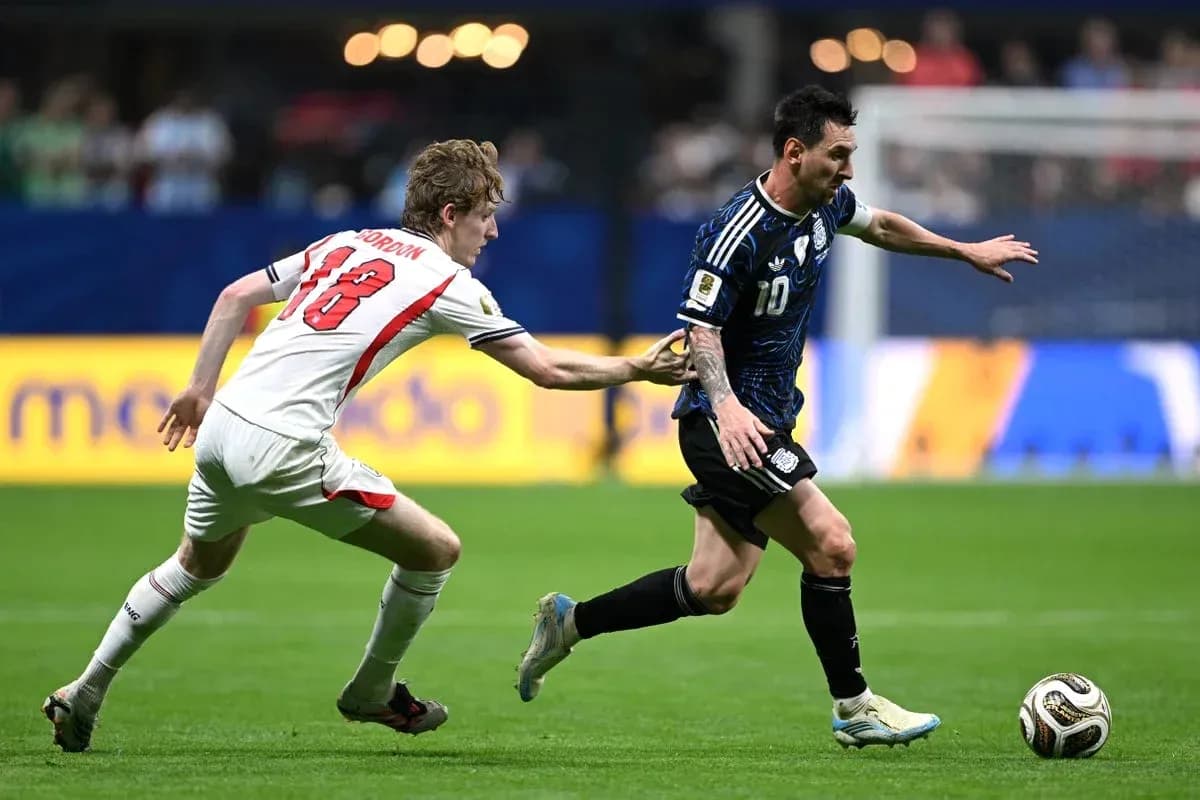 Lionel Messi evading defender during soccer match