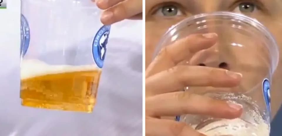 Person drinking from a cup of beer