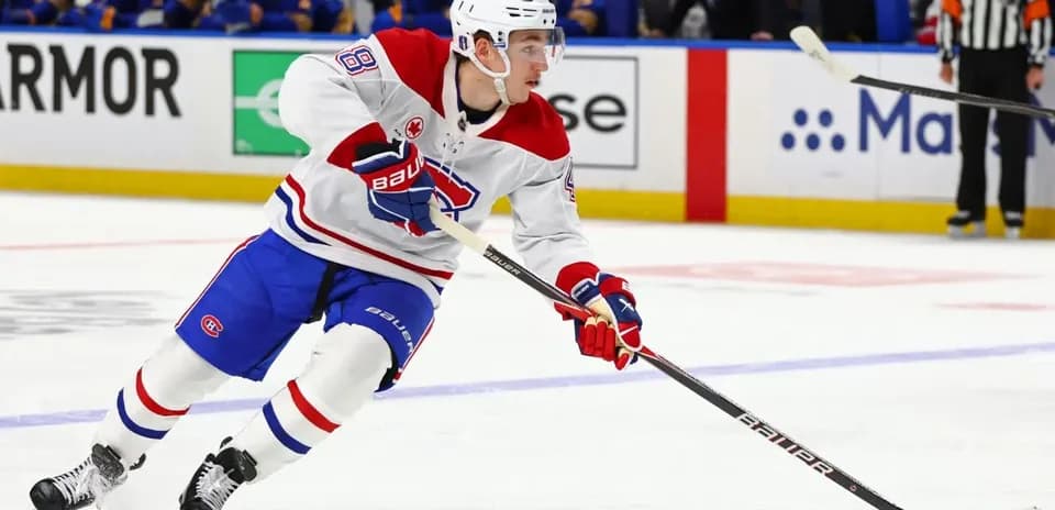 Hockey player skating with puck during game