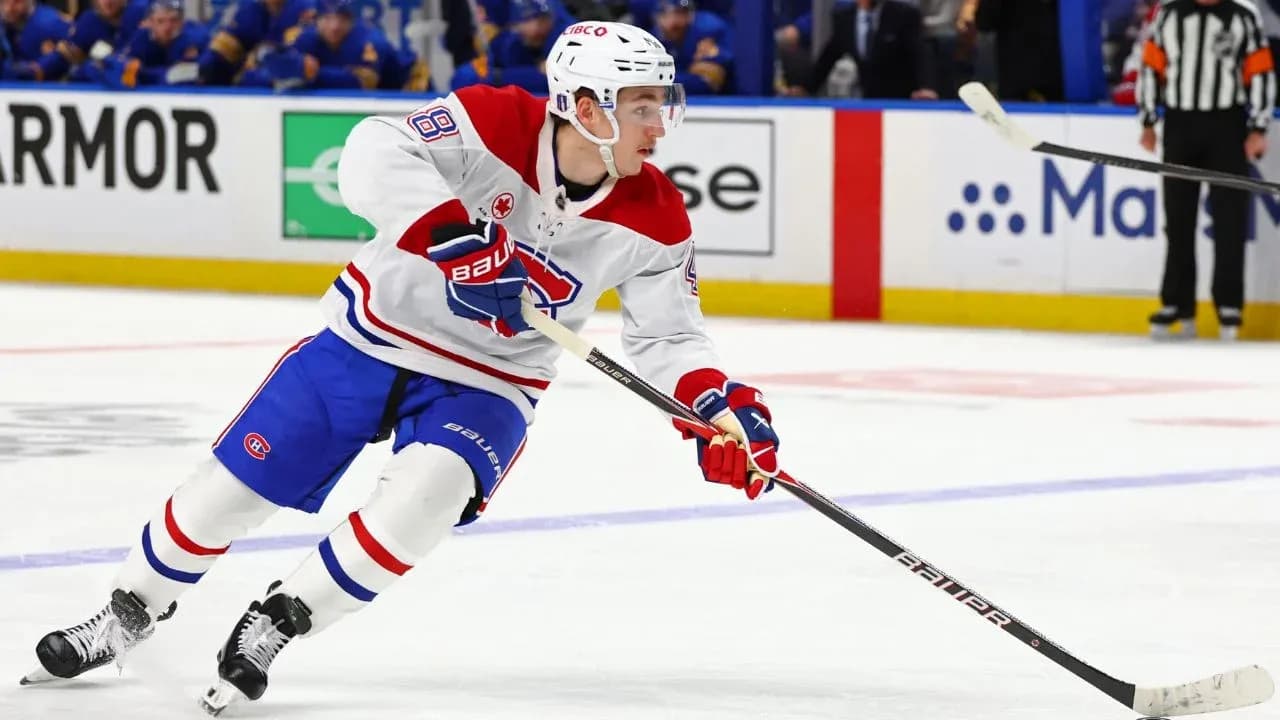 Hockey player skating with puck during game