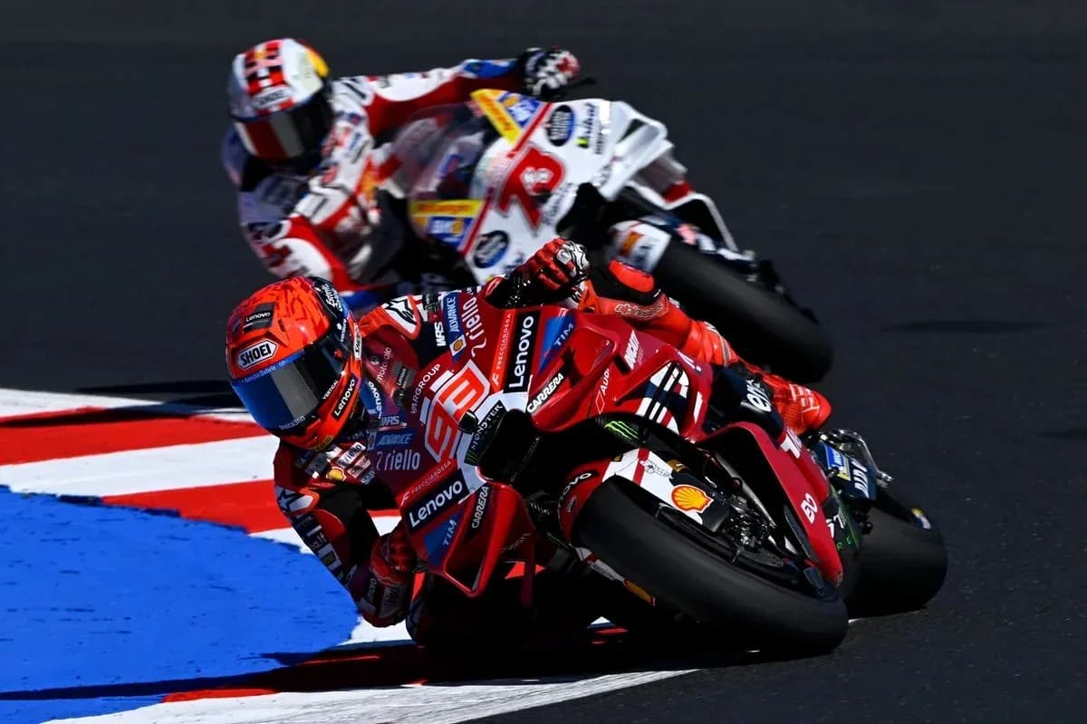 Ducati rider leaning into a turn during race