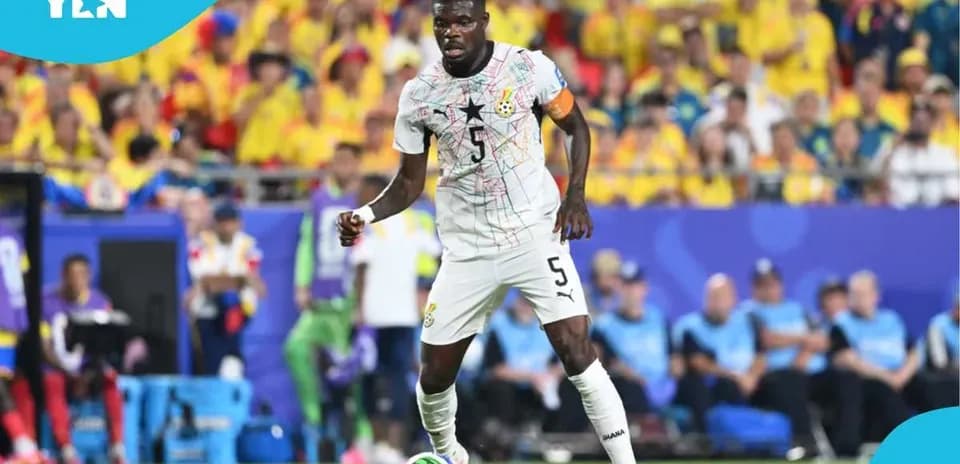 Ghana player dribbling ball during match