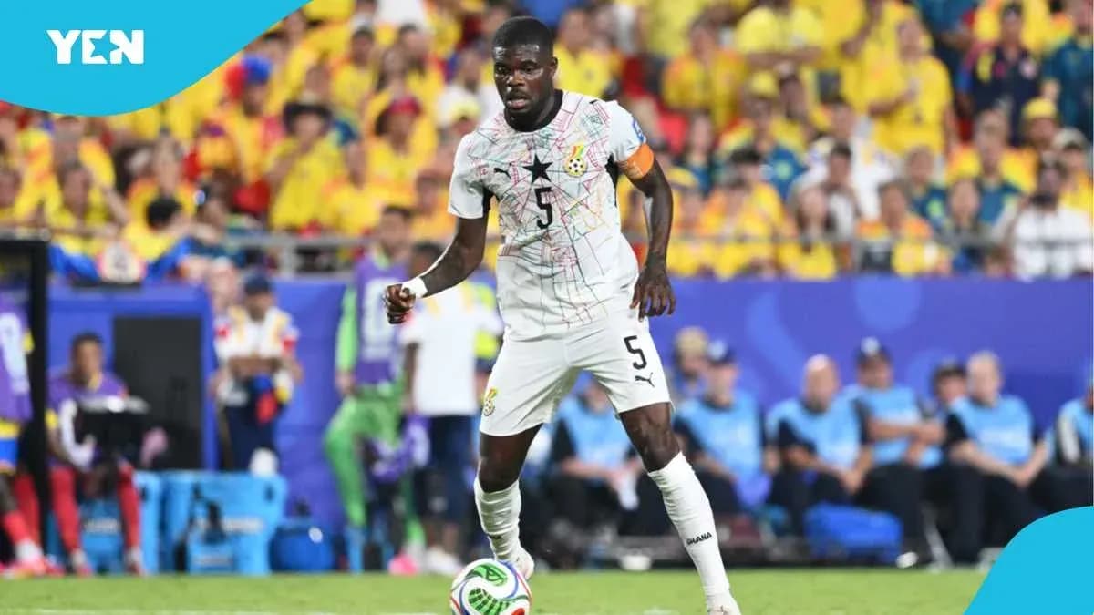 Ghana player dribbling ball during match