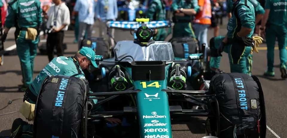 Aston Martin team preparing car on grid