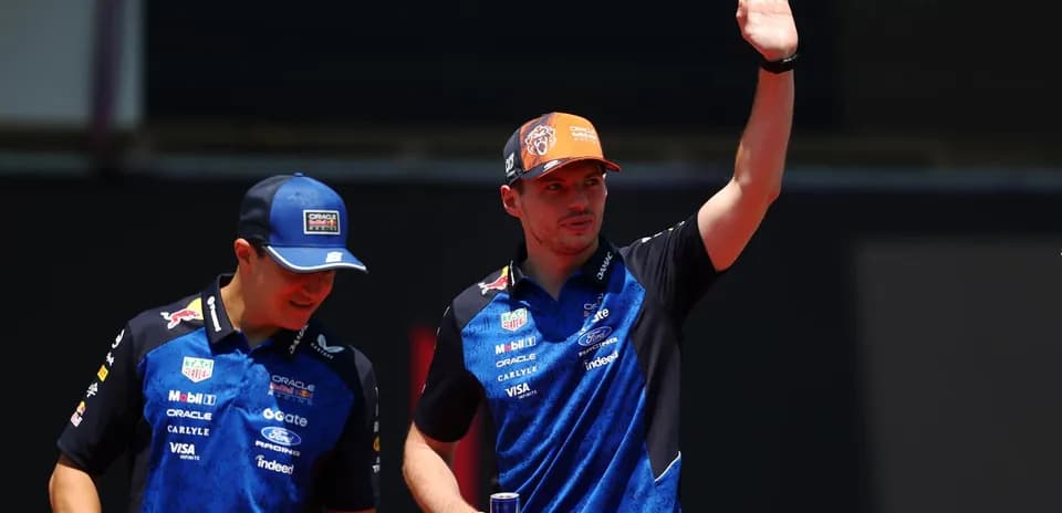 Formula 1 drivers waving during event appearance