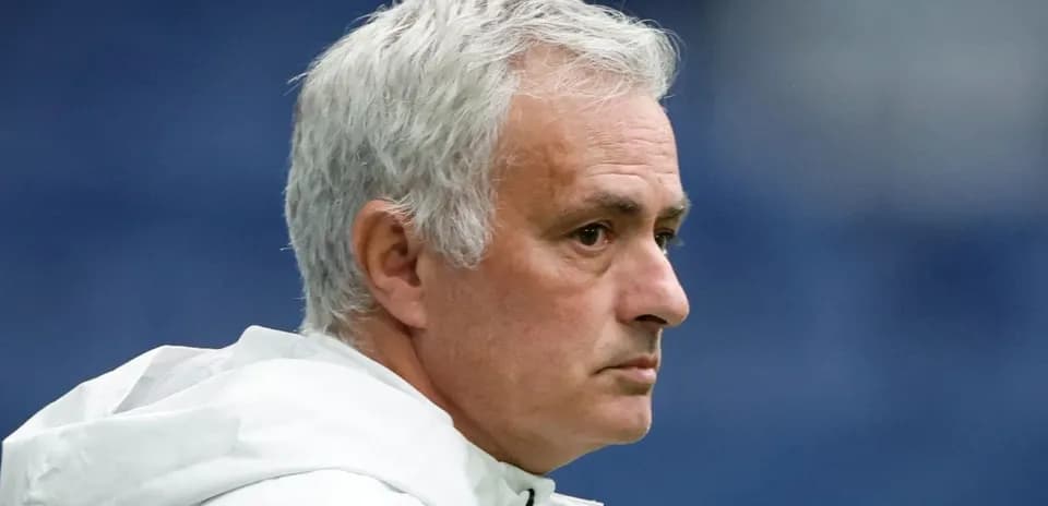 Football manager looking thoughtful on the sidelines