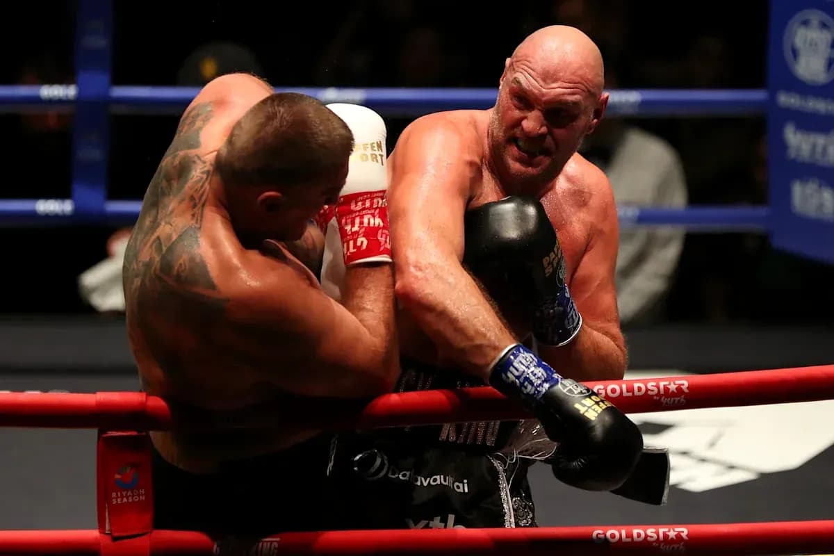 Two boxers exchanging punches in the ring