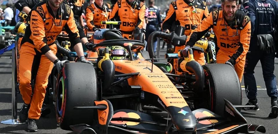 McLaren team preparing car on the grid