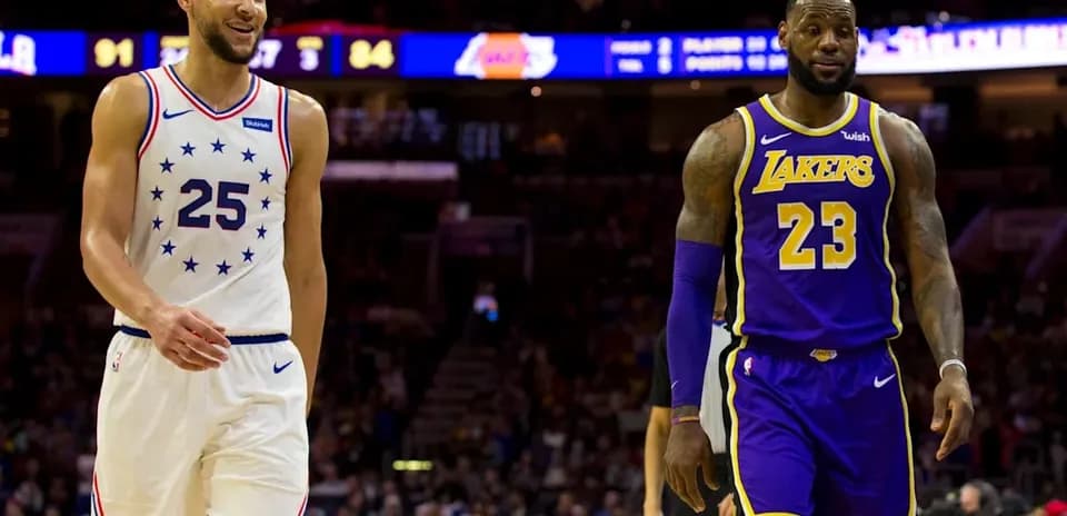 Ben Simmons and LeBron James walking on court