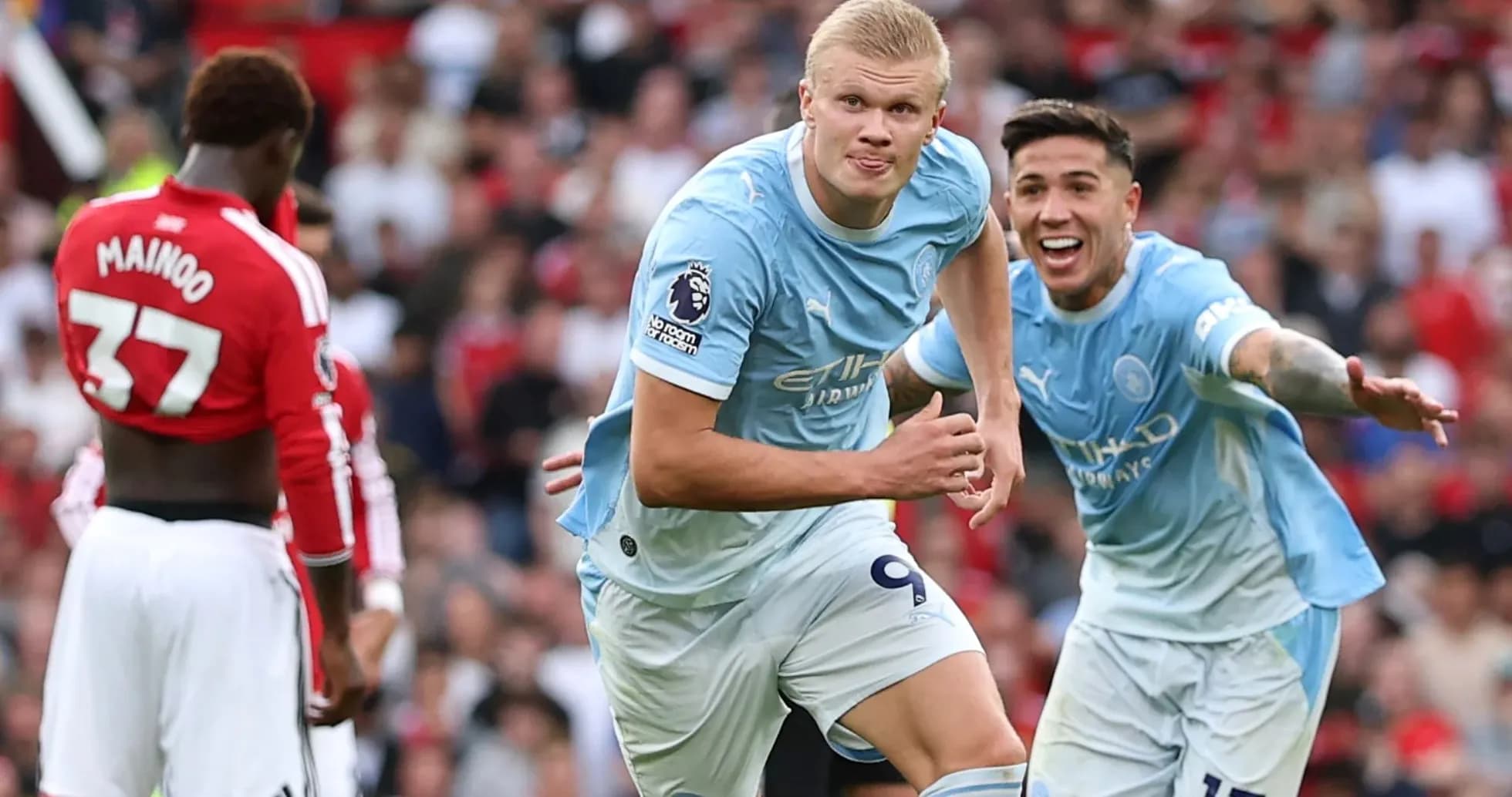 Manchester City players celebrating a goal on pitch