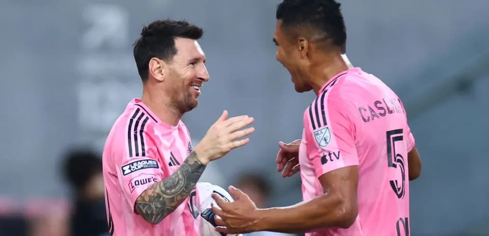Messi and teammate celebrating during match