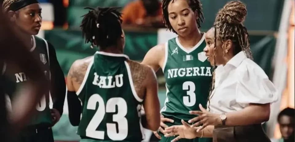 Nigerian basketball team discussing strategy during timeout