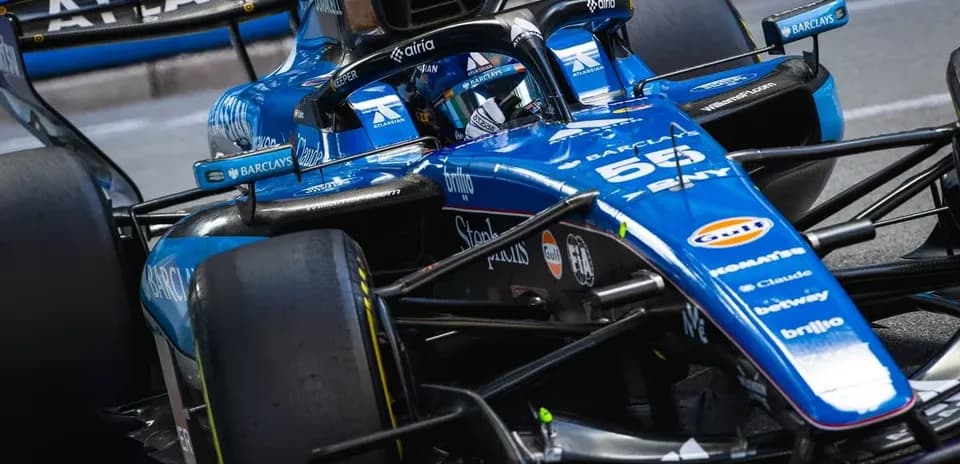Formula 1 car speeding on racetrack