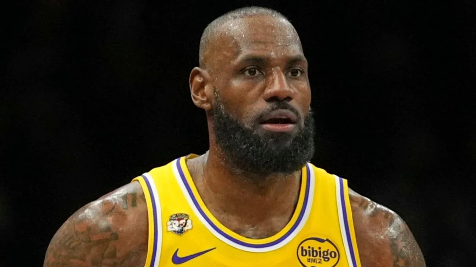 LeBron James in yellow Lakers jersey during game