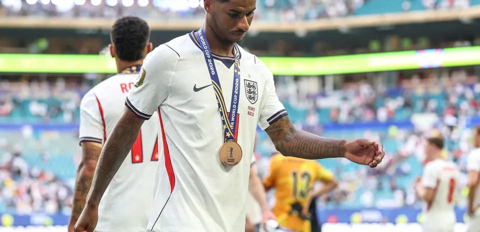 Player walking off field with bronze medal