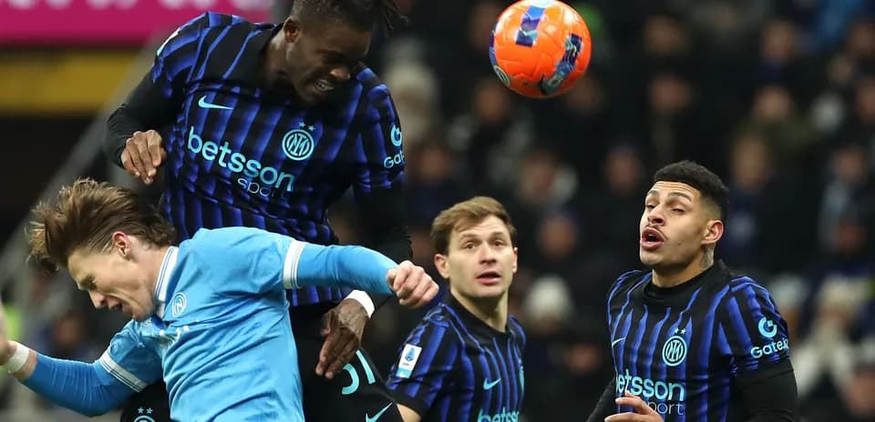 Players contesting a high ball during match action
