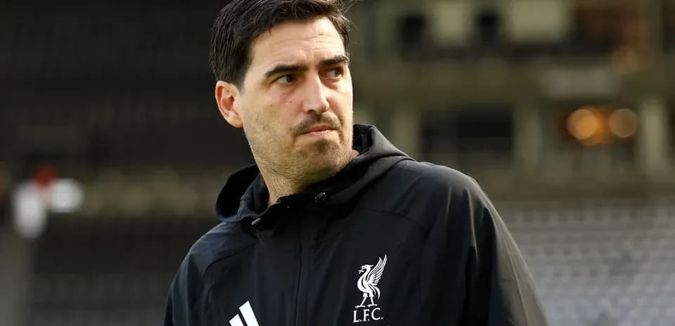 Liverpool coach observing during training session