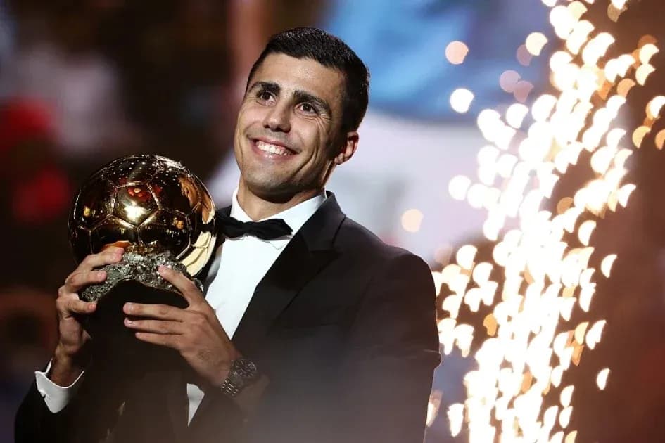 Player holding Ballon d'Or trophy during ceremony