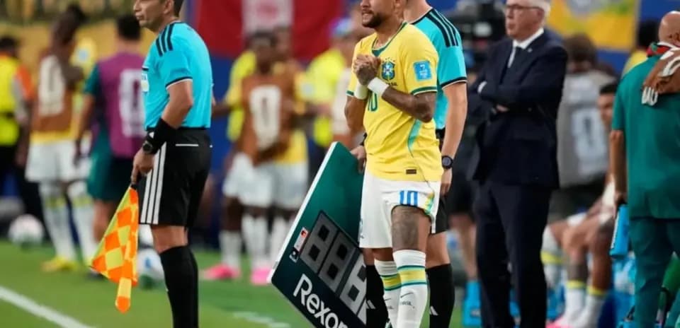 Neymar waiting to substitute during a match