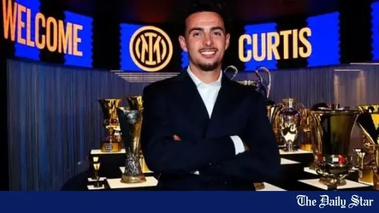 Yoshimura Curtis standing with trophies at presentation