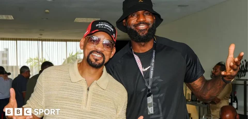 Will Smith and LeBron James posing together indoors