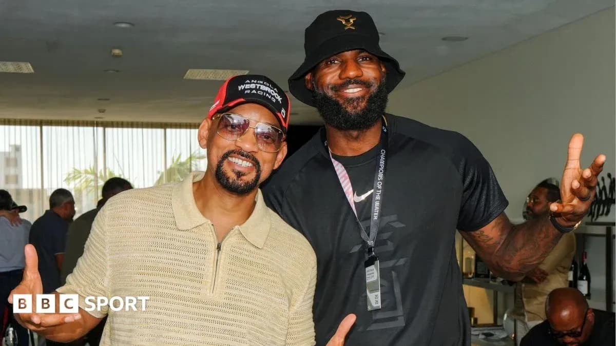 Will Smith and LeBron James posing together indoors