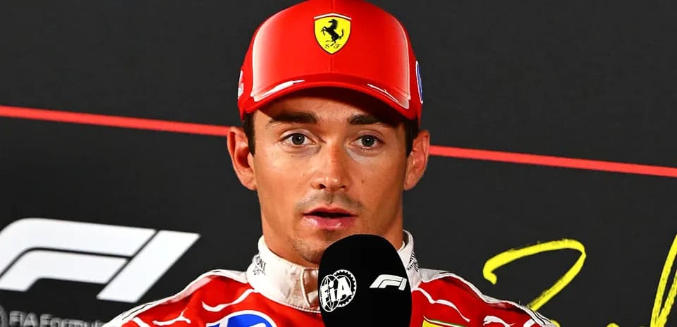 F1 driver speaking at press conference with microphone