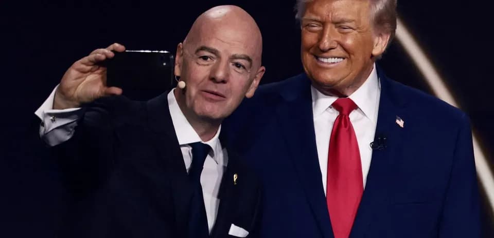 Two men taking a selfie at event
