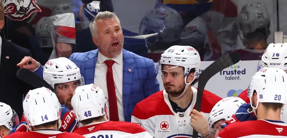 Hockey coach instructing players during timeout