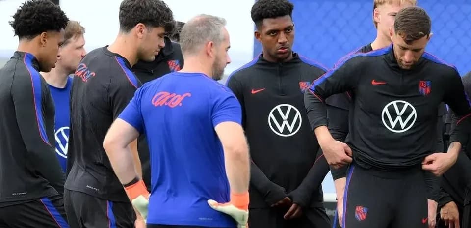 USA soccer team in training session discussing strategy
