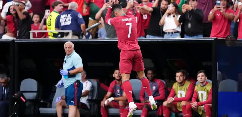 Cristiano Ronaldo celebrating with fans in stadium