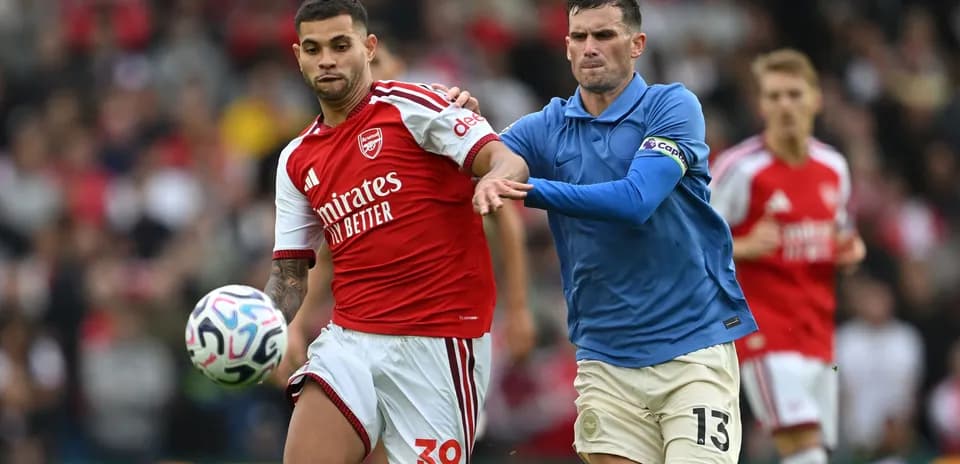 Two players competing for the ball during match